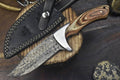 Custom handmade J2 steel hunting knife with a 10-inch pakkawood handle, steel bolster, and leather sheath.