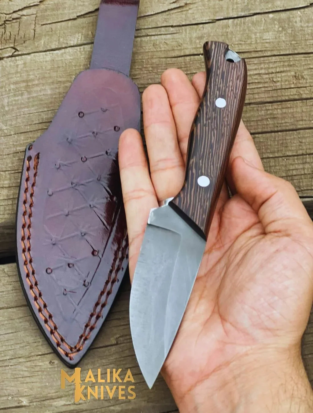 Handmade straight edge skinning knife by MALIKA KNIVES with wenge wood handle, ideal for precision skinning tasks.