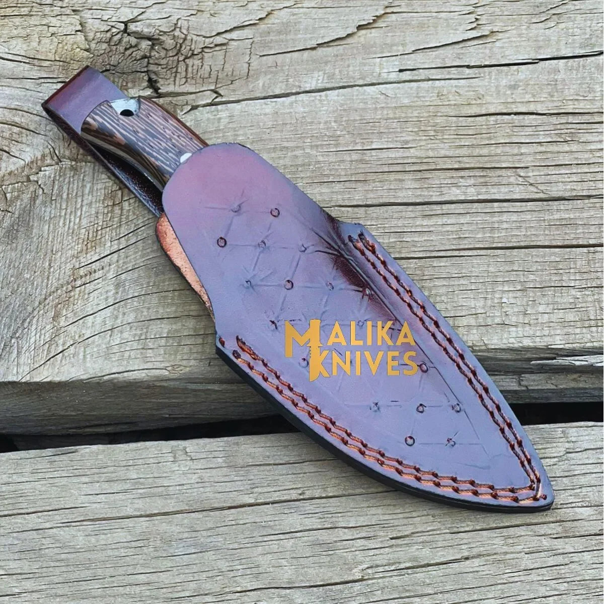 Handmade straight edge skinner knife with Wenge wood handle by MALIKA KNIVES, showing the sleek blade and rich wood grain.