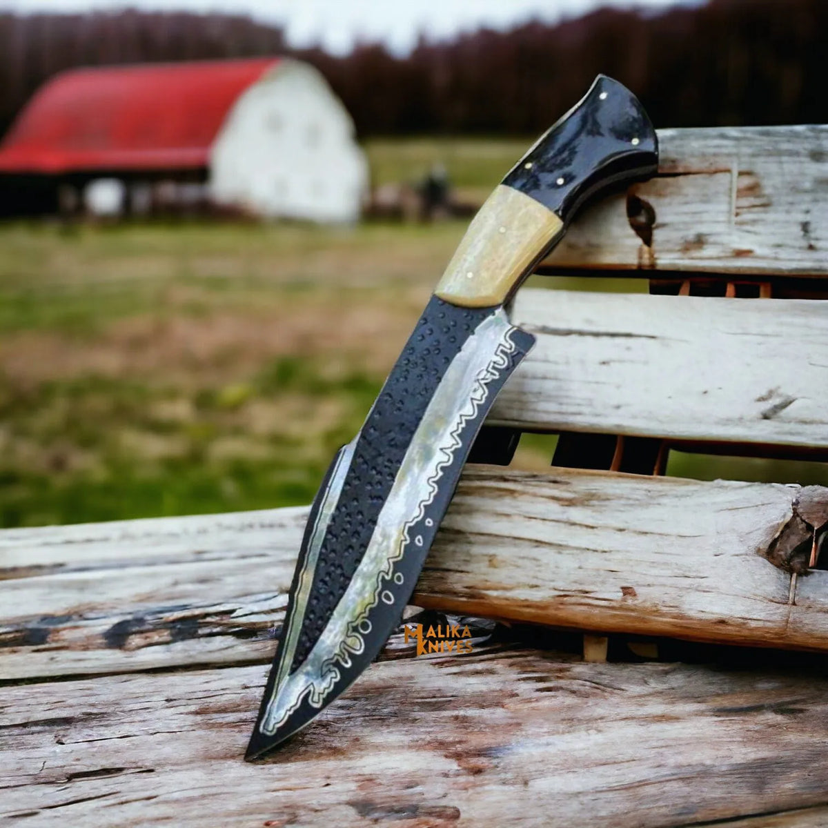 D2 steel Bowie knife with camel bone and bull horn handle by Malika Knives, featuring a simple, sturdy design and polished blade.