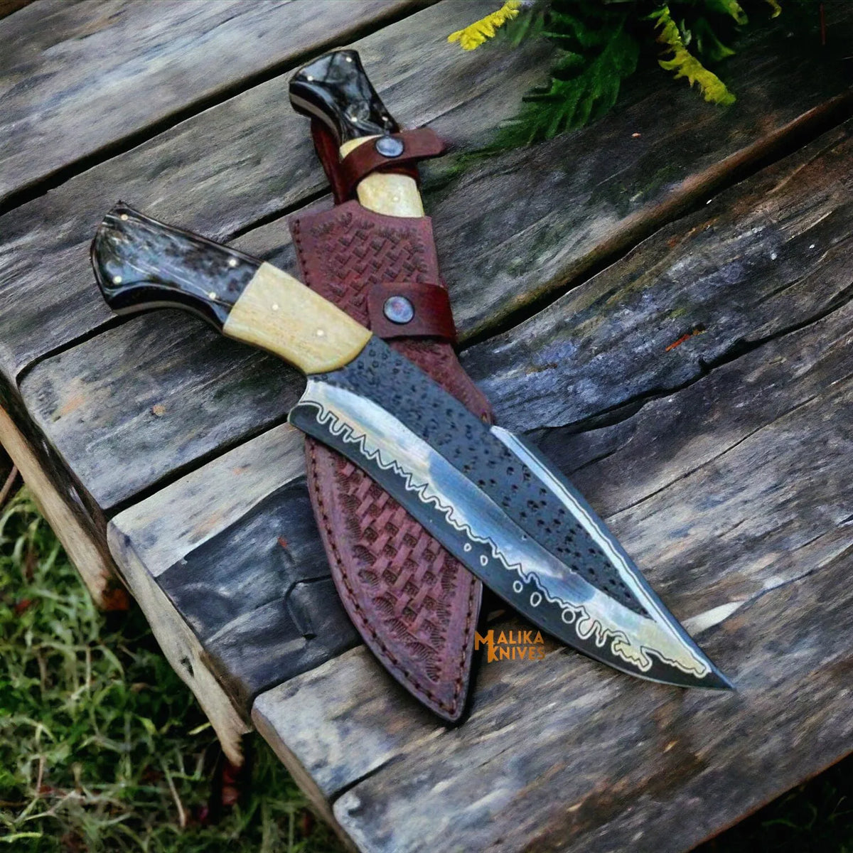 D2 steel Bowie knife with camel bone and bull horn handle by MALIKA KNIVES, featuring a simple design and sharp blade.