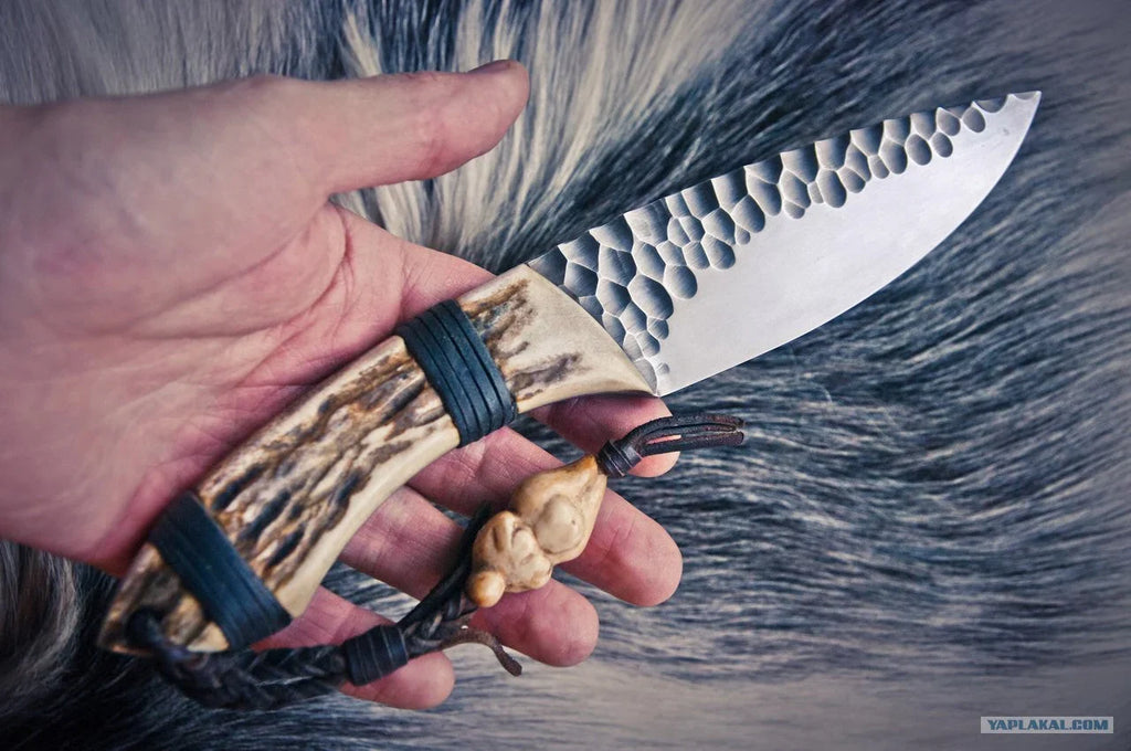 Handmade skinning hunting knife from Knives Gear Garage with a sleek blade and wooden handle, ideal for outdoor hunting activities.