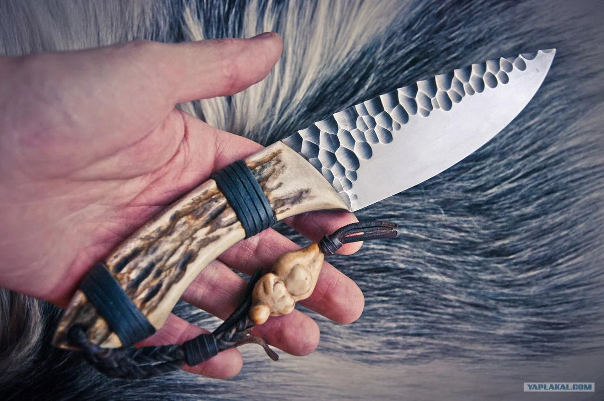 Handmade skinning hunting knife from Knives Gear Garage with a sleek blade and wooden handle, ideal for outdoor hunting activities.