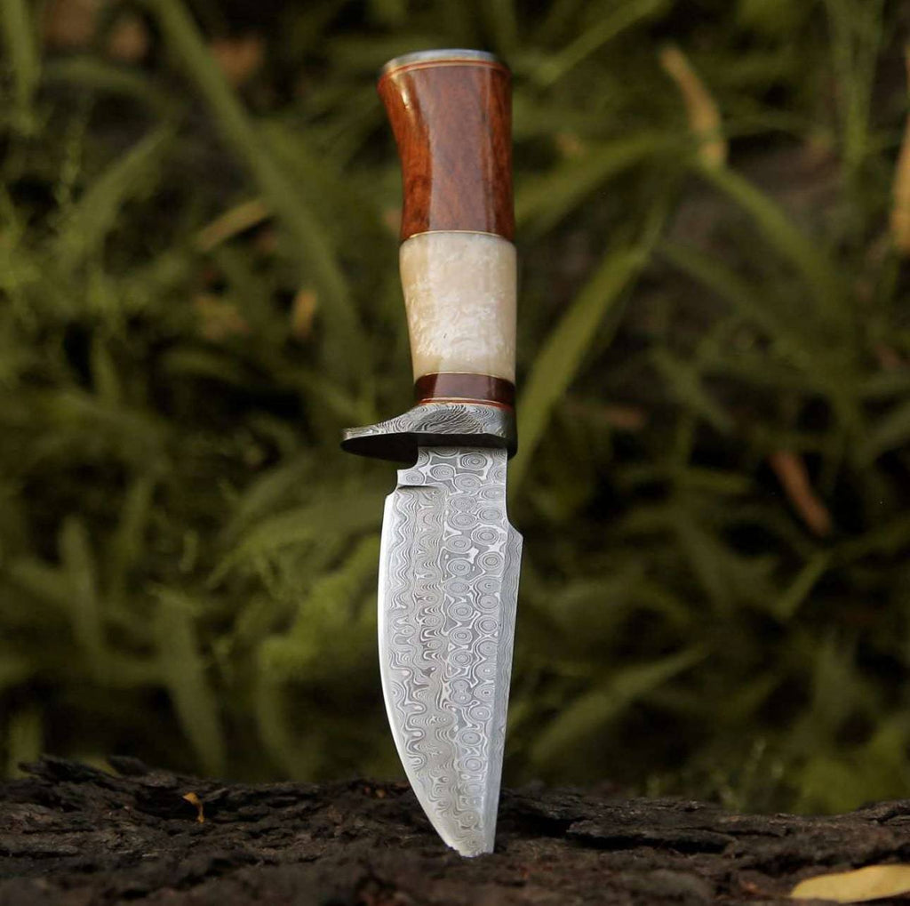 CSKforged Elite Damascus hunting knife with mother of pearl and rose wood handle, featuring a sharp blade and elegant craftsmanship.