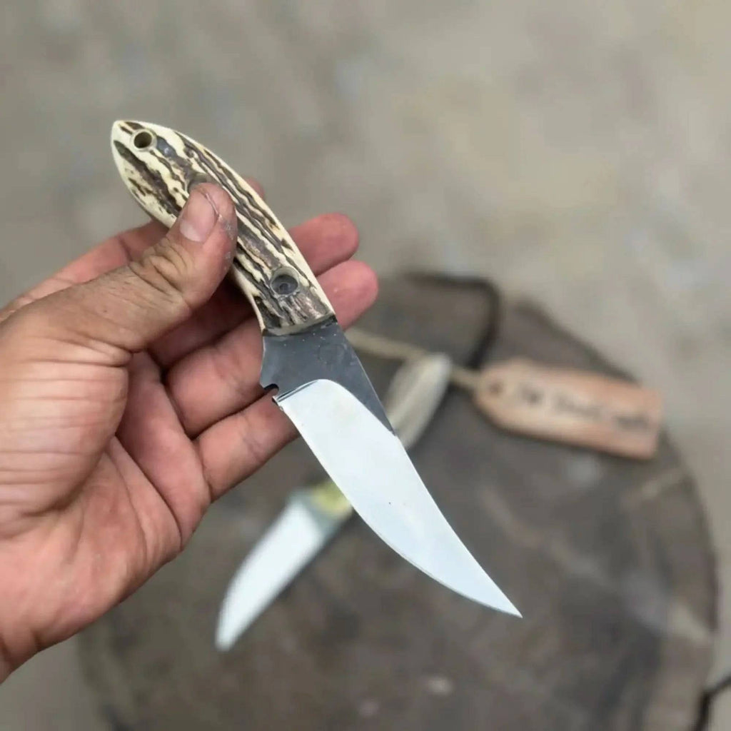 High Carbon Upswept Skinner Knife by JW SteelCrafts with synthetic stag horn handle, fixed blade hunting knife for skinning tasks.