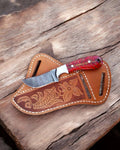 Handmade ranch cowboy EDC knife by cskforged with 7.5-inch Damascus steel blade and matching leather sheath.