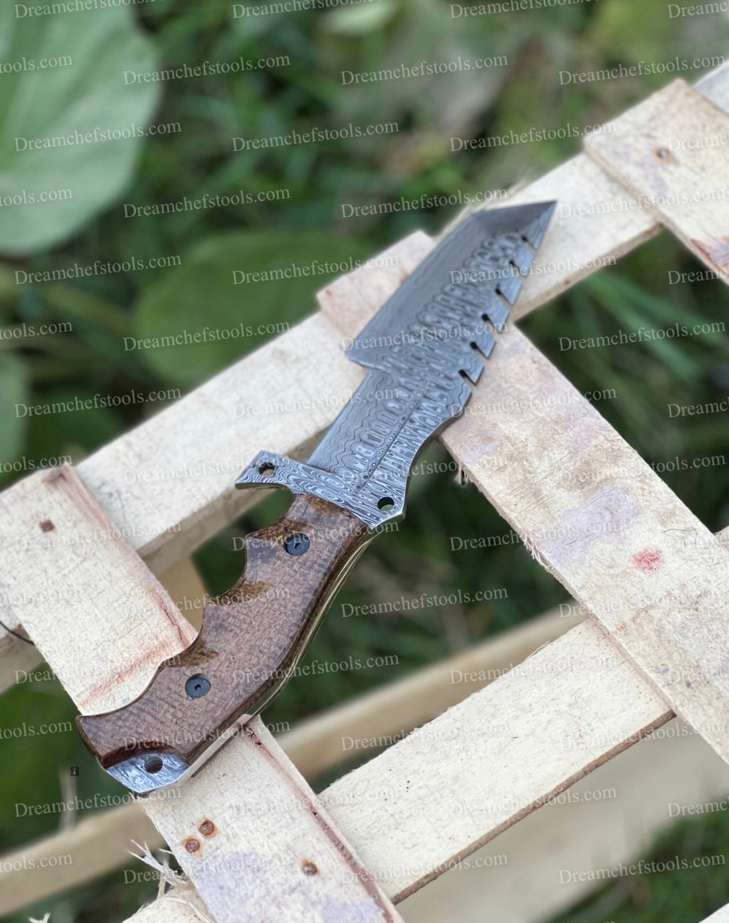 Custom handmade Damascus steel tracker knife with a textured handle and sharp blade, crafted by Knives Gear Garage.