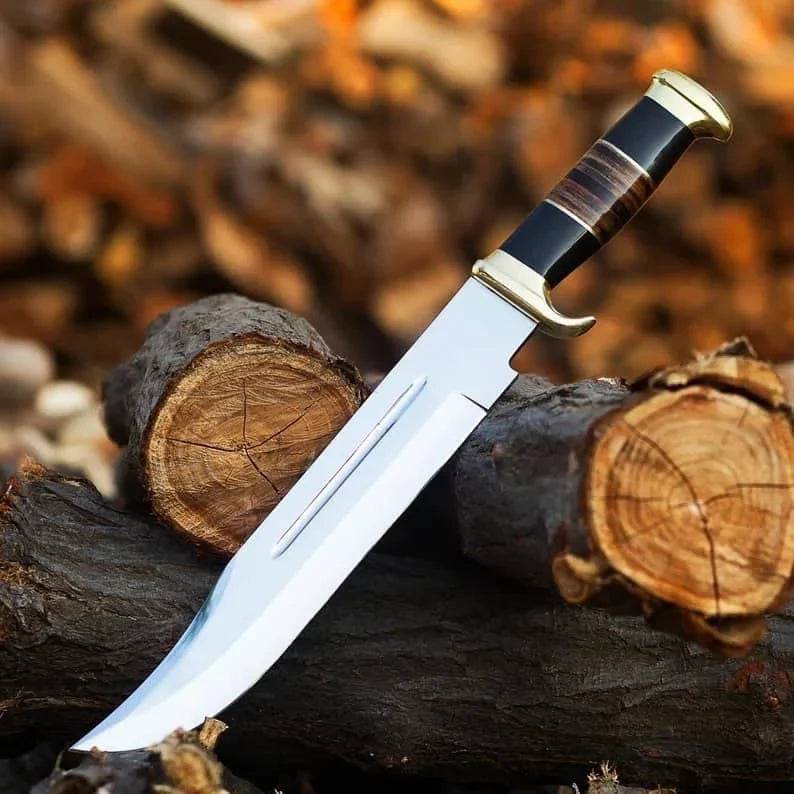 Premium handmade D2 steel Crocodile Dundee survival knife by cskforged with a rugged blade and textured handle, displayed on a neutral background.