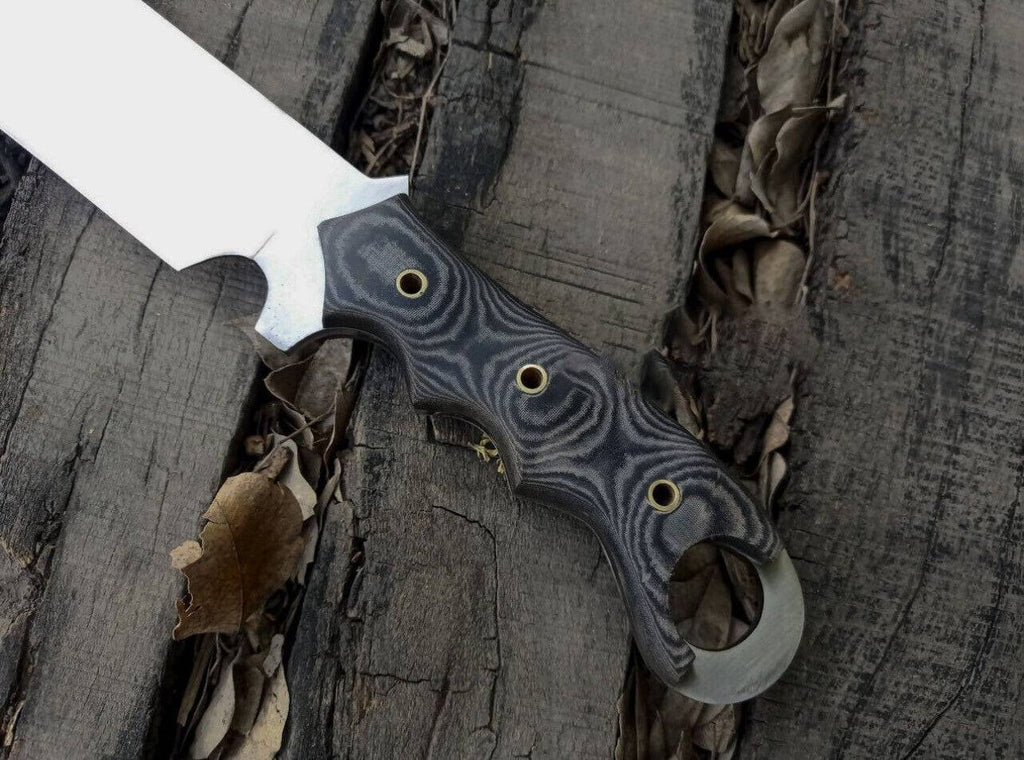 Black Talon Ravenclaw Combat Survival Knife by cskforged with a sharp blade and durable handle for outdoor and tactical use.