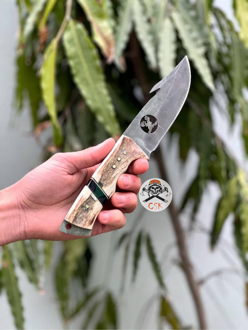 Handcrafted carbon steel hunting knife with antler handle by cskforged, designed for bushcraft and survival tasks.