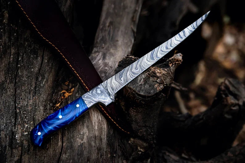 Custom 13-inch Damascus fillet knife with blue resin handle and forged steel bolster from Knives Gear Garage.