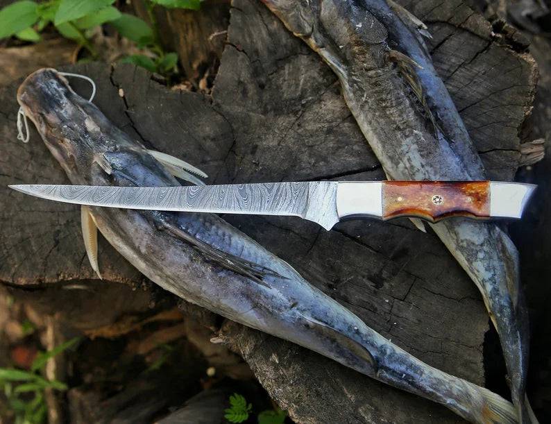 Custom 13-inch Damascus steel fillet knife with camel bone handle and leather sheath, crafted by Knives Gear Garage.