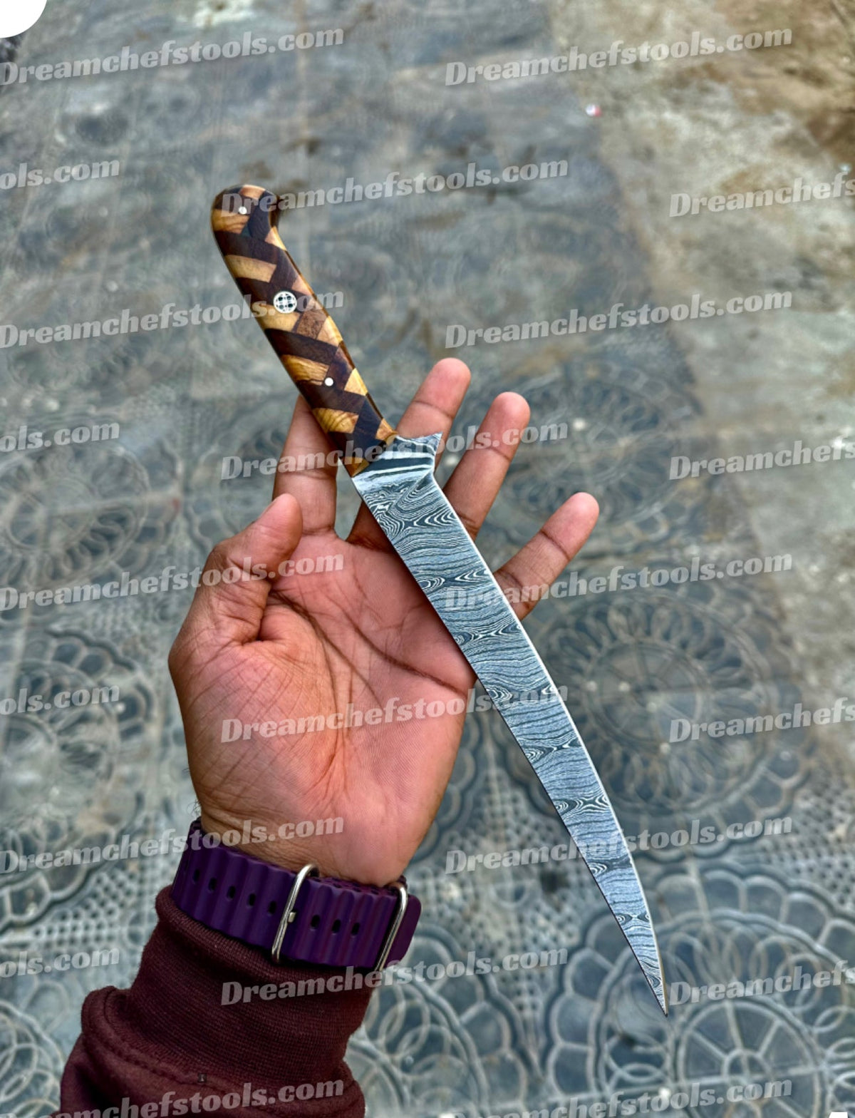 Custom handmade Damascus steel fillet knife with a twisted pattern and rosewood and olive wood handle, 13-inch length.