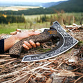 MALIKA KNIVES Vegvisir Viking pizza cutter axe with hand-forged blade and leather sheath, featuring detailed Viking design.
