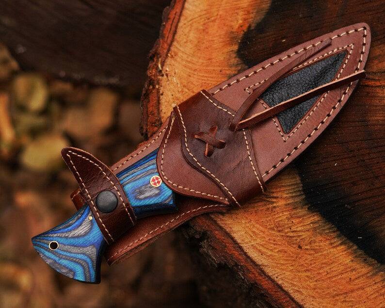 Damascus steel hunting knife by cskforged with a textured handle and sharp blade, perfect for outdoor hunting and tactical use.