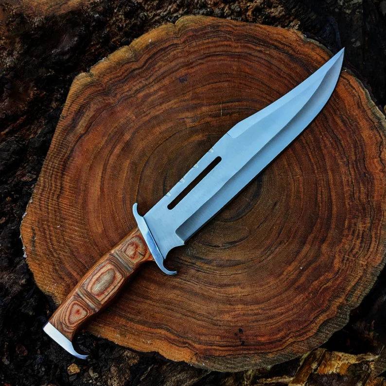 Close-up of cskforged Rambo Knife with D2 steel blade, featuring a rugged handle and sharp edge for survival and outdoor use.
