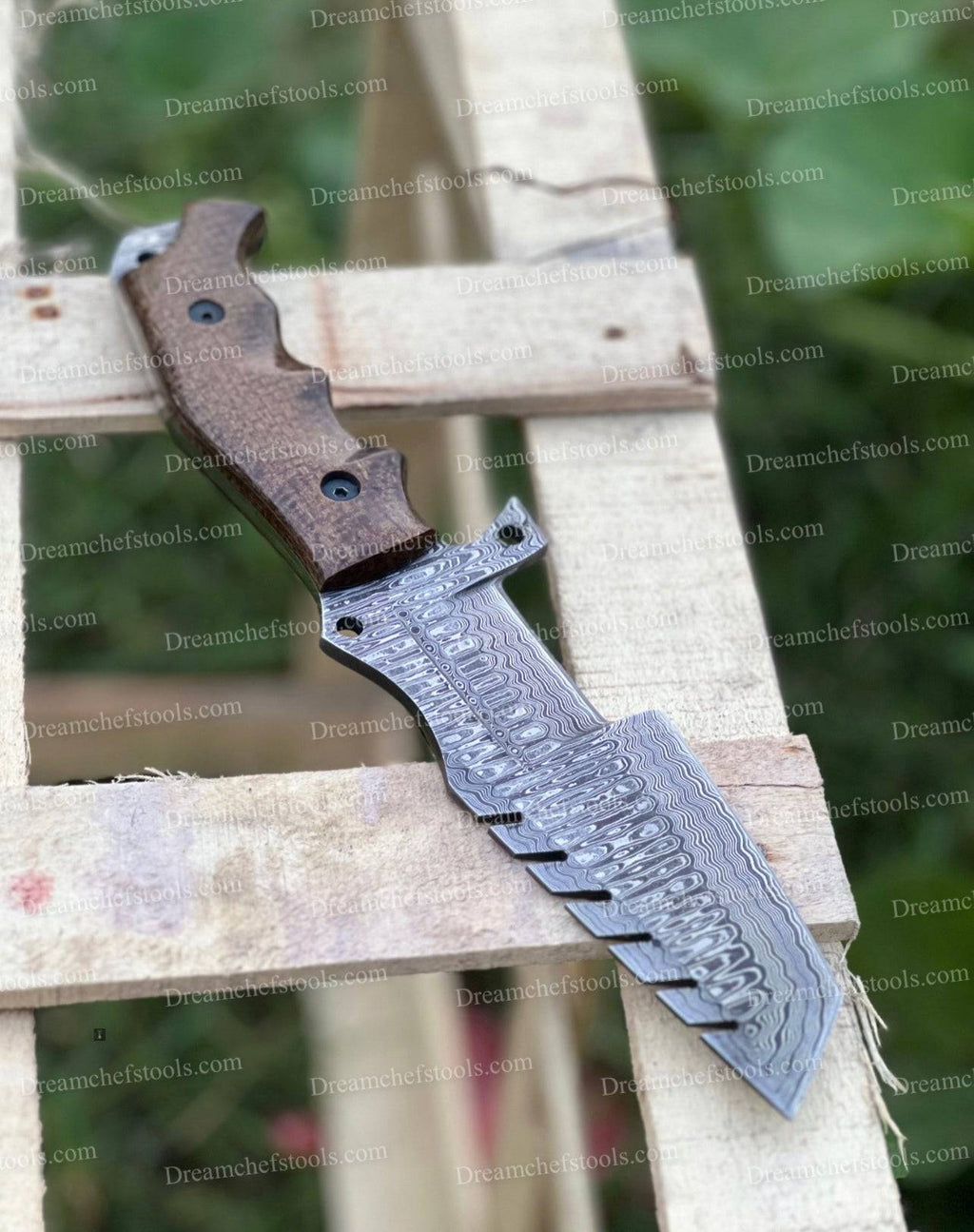 Custom handmade Damascus steel tracker knife with intricate patterning and sturdy handle by Knives Gear Garage.
