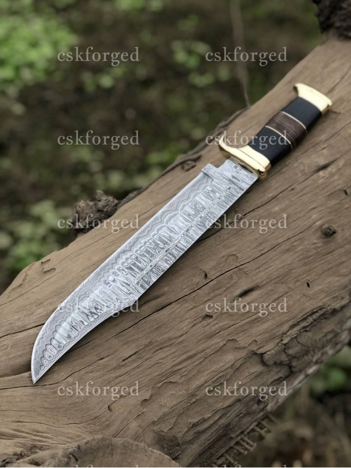 Handmade Damascus Steel Crocodile Dundee knife by cskforged, featuring a detailed blade and sturdy handle in the image.