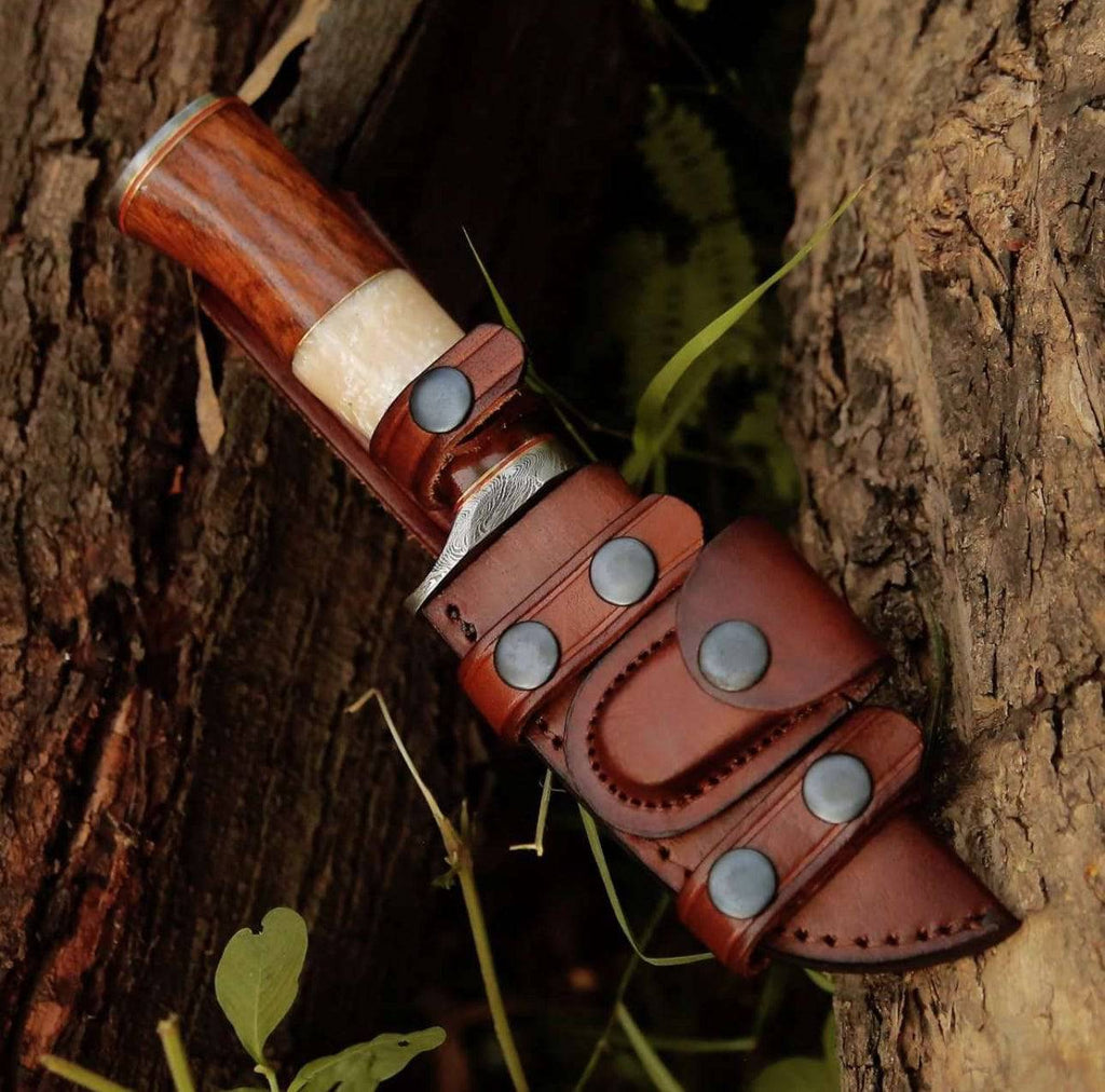 CSK Forged Elite Damascus hunting knife with Mother of Pearl and rose wood handle, featuring a sharp blade and intricate design.