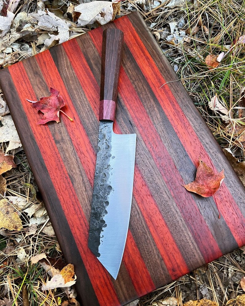 Lightweight chef knife from Knives Gear Garage with a sharp blade and ergonomic handle, ideal for precise kitchen prep.