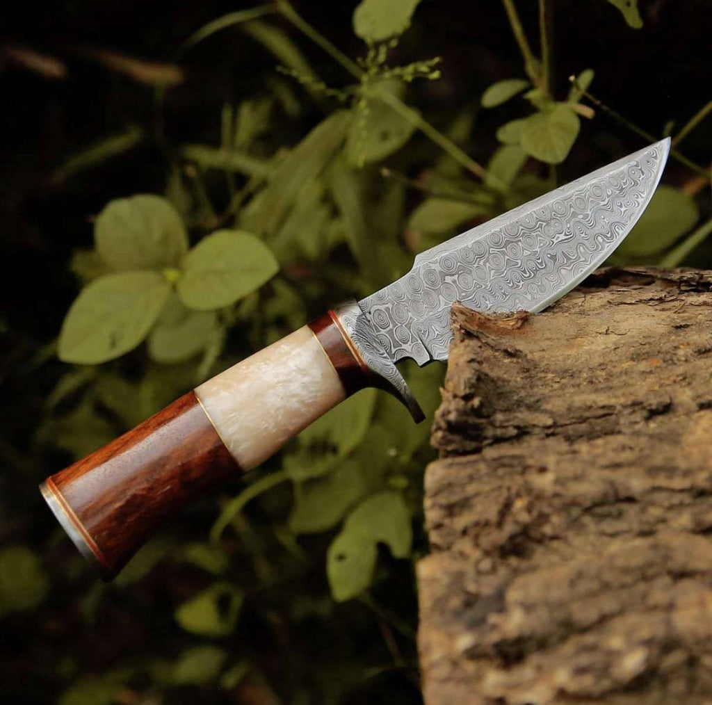 CSKforged Elite Damascus hunting knife with mother of pearl and rose wood handle, showcasing a detailed blade and elegant handle design.
