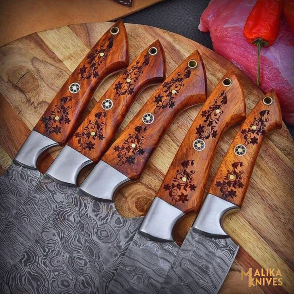 Stainless steel chef knives set by MALIKA KNIVES with multiple blades, perfect for professional and home cooking.