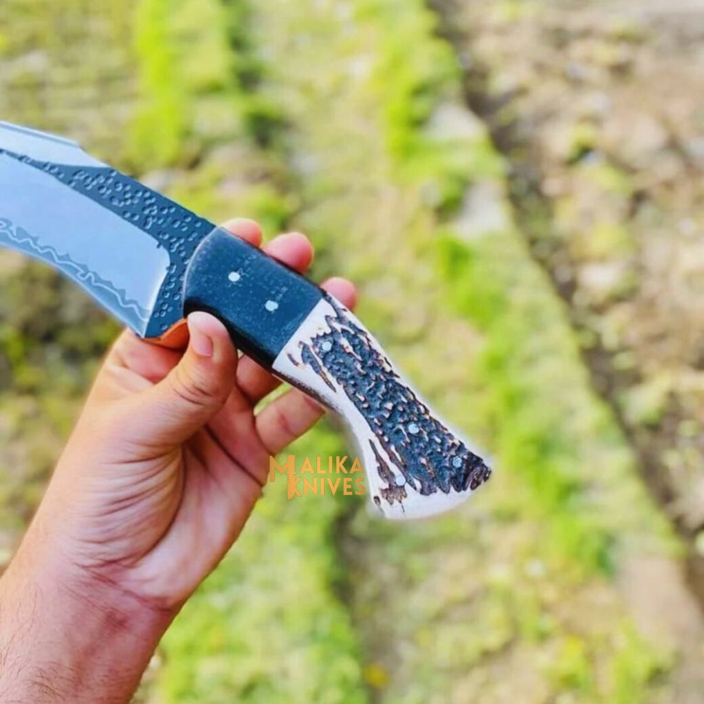 Malika Knives D2 Stag hunting knife with a 7-inch full tang blade, ideal for outdoor survival and hunting tasks.
