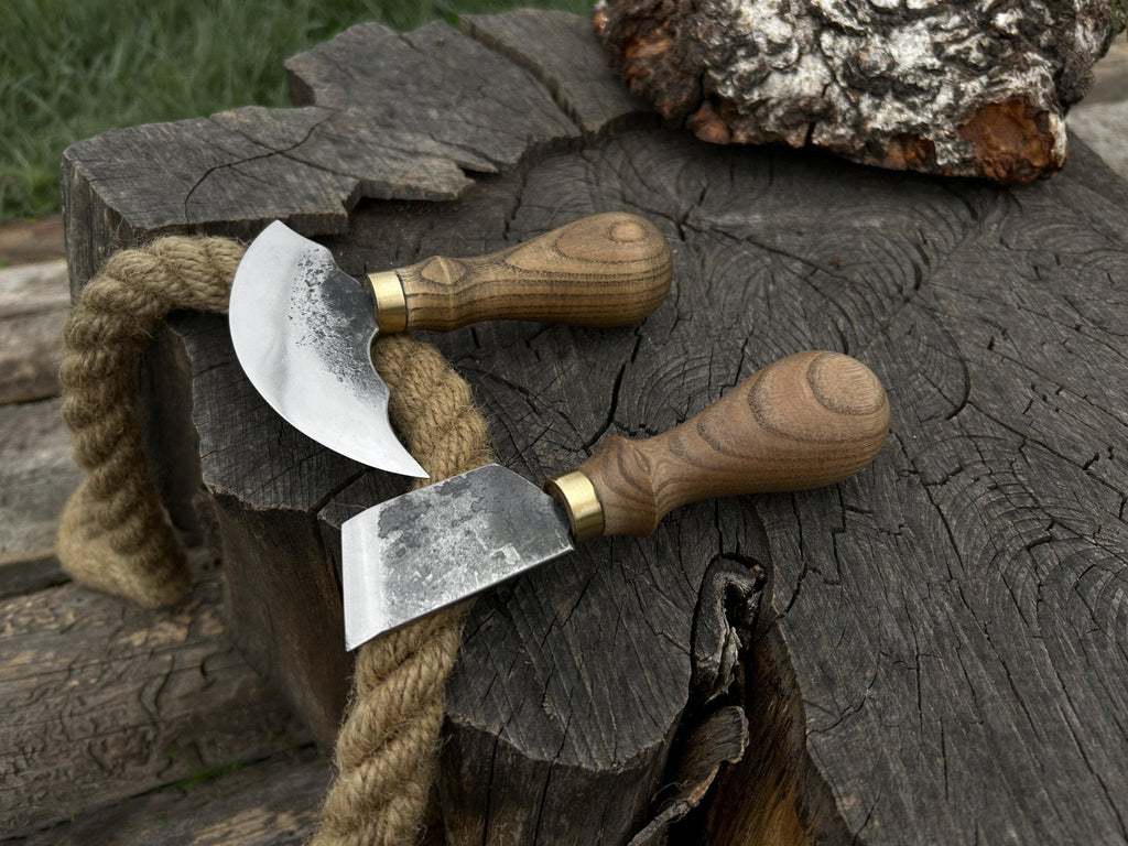 Two-piece Sharky Forged Steel Tools leather knife set with rounded and angled blades, handcrafted for precision cooking.