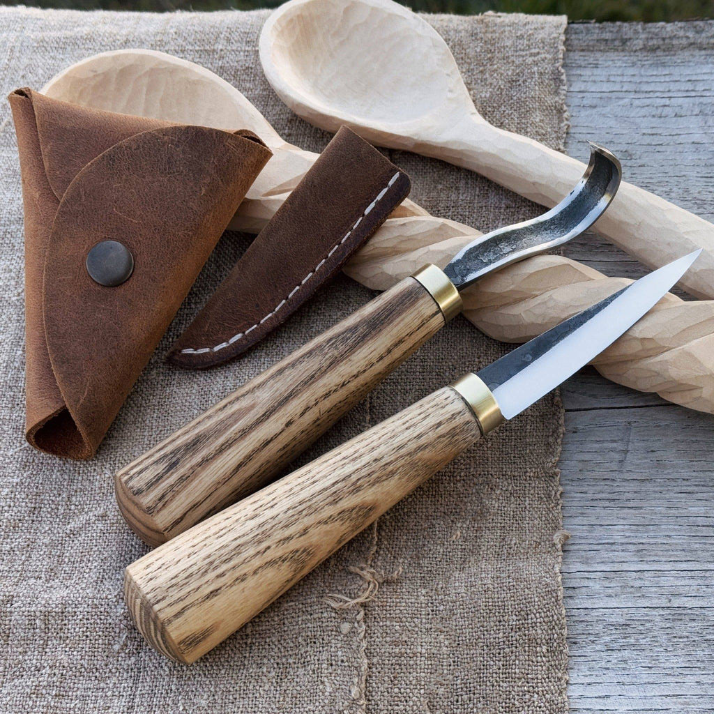 Sharky Forged Steel Tools 2-piece spoon carving knife set with leather sheaths, featuring ergonomic handles and precision blades.