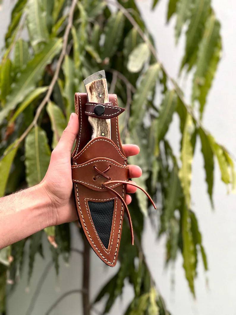 Handcrafted carbon steel hunting knife with antler handle by cskforged, featuring a rugged bushcraft survival blade.