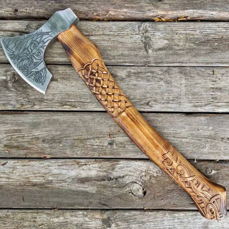 Viking axe lover with wooden handle and metal blade, featuring intricate carvings, from Knives Gear Garage.