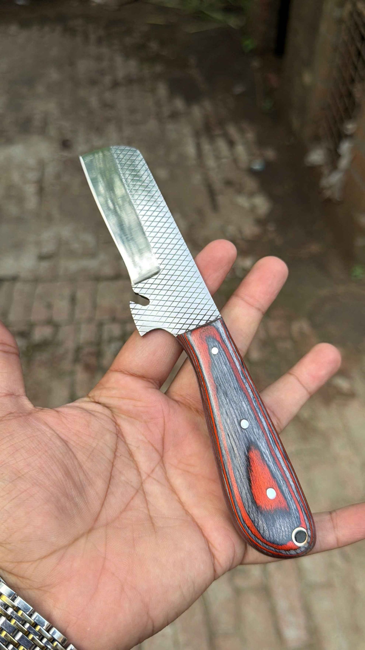 JW Steelcrafts Skyvein Bull Cutter Knife 7-inch handmade carbon steel knife with resin handle, displayed in a set of bull cutter knives.