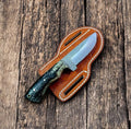 Custom cowboy knife with 8.5-inch sheep horn handle and Damascus steel blade, displayed on a neutral background.
