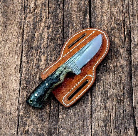 Custom cowboy knife with 8.5-inch sheep horn handle and Damascus steel blade, displayed on a neutral background.
