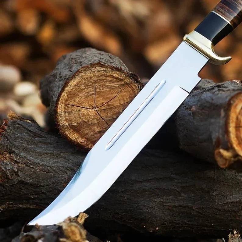 Handmade D2 steel Crocodile Dundee survival knife with textured handle and sharp blade, crafted by cskforged.