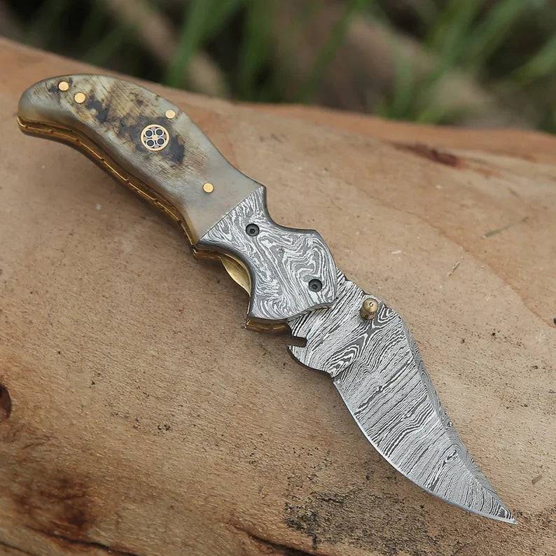 Damascus pocket folding knife with engraved handle, clip, and handmade design from Knives Gear Garage, ideal for everyday carry and gifting.
