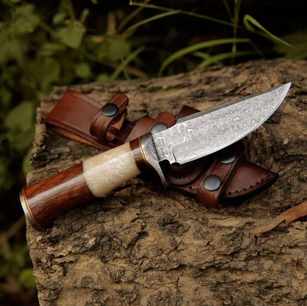CSKforged Elite Damascus hunting knife with Mother of Pearl and rose wood handle, showcasing intricate blade details and elegant grip.