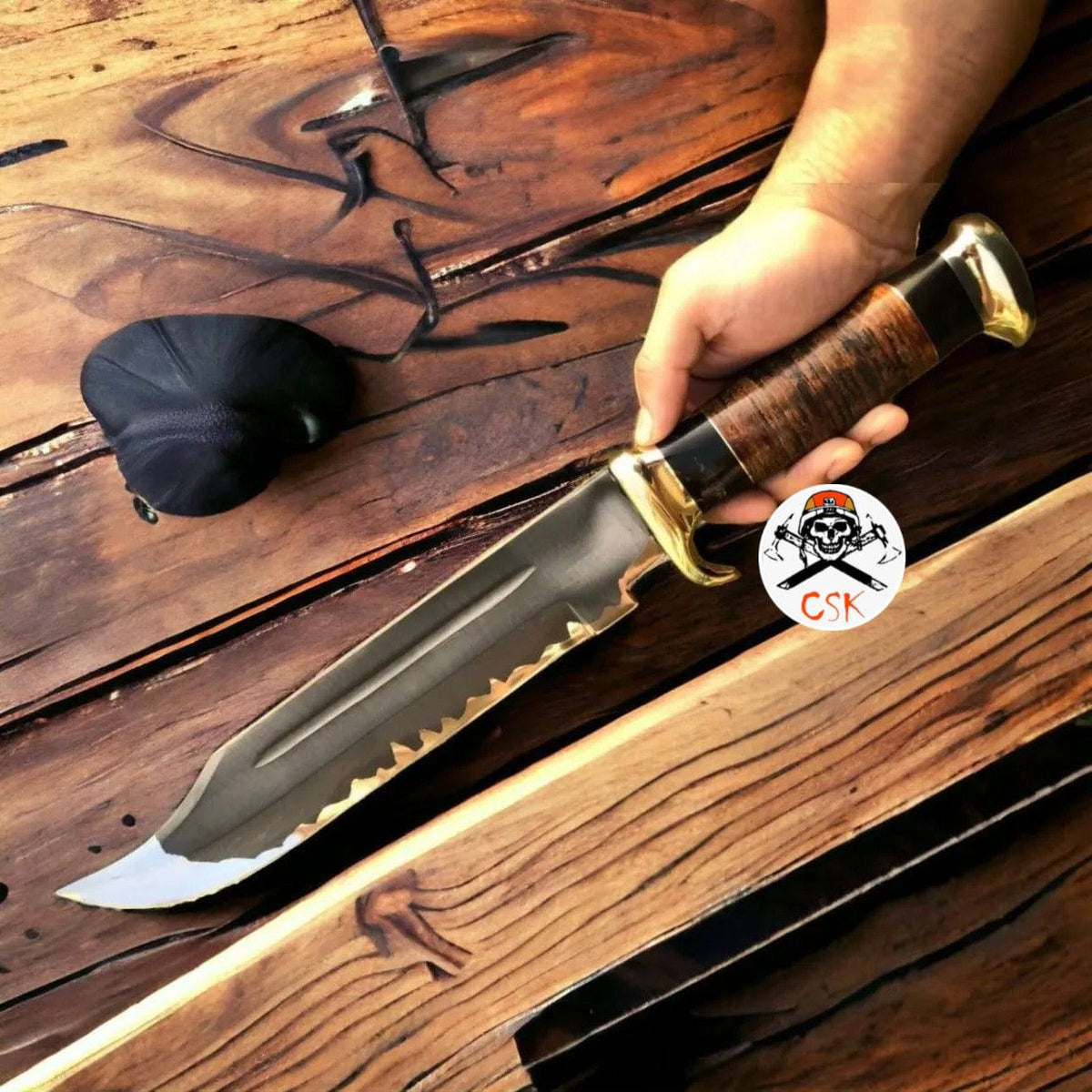 D2 steel Crocodile Dundee hunting knife by cskforged with acid etched blade, shown with a textured handle and hunting blade design