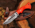 Damascus steel hunting knife by cskforged featuring a textured blade and ergonomic handle for outdoor hunting activities.