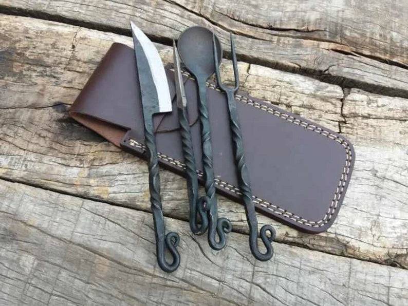 Hand-forged antique medieval chef knife from cskforged with a polished blade and ornate handle design.