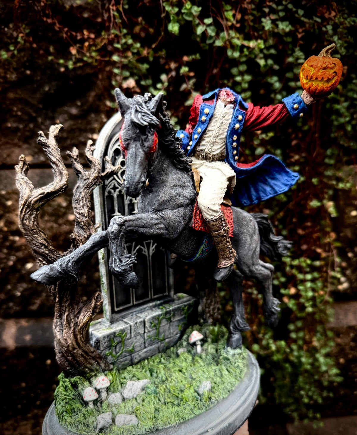 Full-color resin Headless Horseman riding statue by Dellamorte & Co., gothic Sleepy Hollow figurine for spooky Halloween decor.