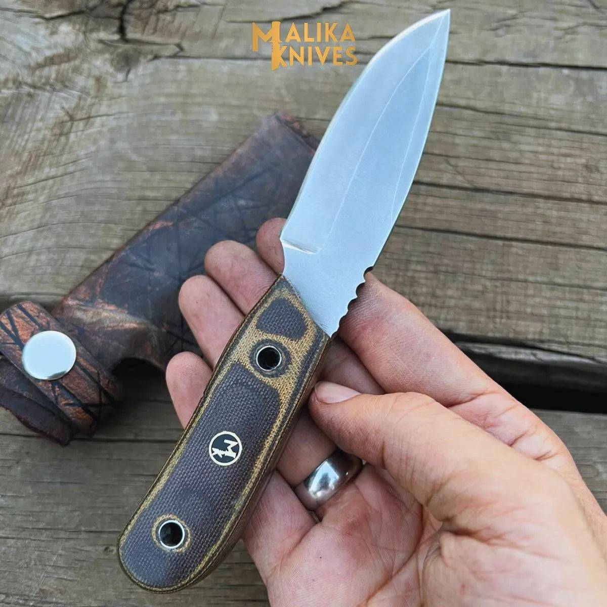 Close-up of a handcrafted MALIKA KNIVES EDC knife with a sleek blade, showcasing its simple, durable design for everyday use.