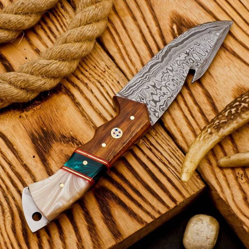 Hunting camping knife from Knives Gear Garage with a sharp blade and ergonomic handle, ideal for outdoor survival and camping tasks.