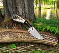 Damascus steel fixed blade EDC knife by cskforged with a textured handle and sharp blade for everyday carry.