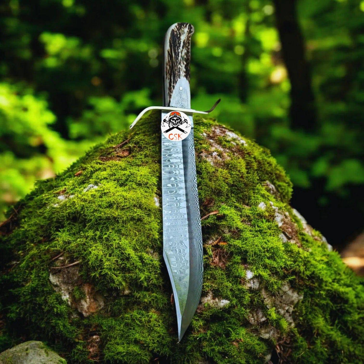 Damascus stag hunting knife with custom leather sheath by cskforged, featuring intricate blade design and handcrafted leather details.