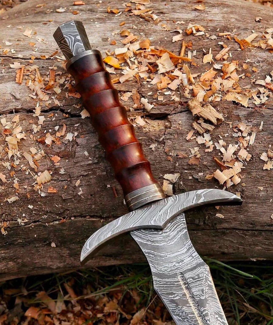 Kingslayer arming sword with Damascus blade, knight sword by cskforged, featuring a detailed hilt and patterned steel blade.
