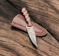 Handmade Damascus hunting knife with an 8-inch blade and wood handle, showcasing intricate Damascus steel pattern and craftsmanship.