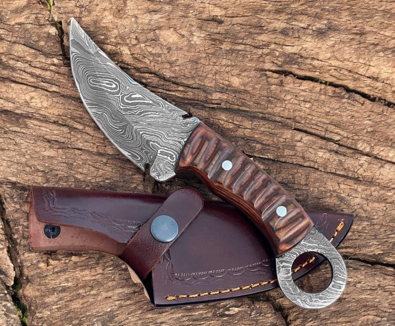 Handmade Damascus hunting knife with an 8-inch blade and wood handle, featuring intricate Damascus steel pattern and ergonomic grip.