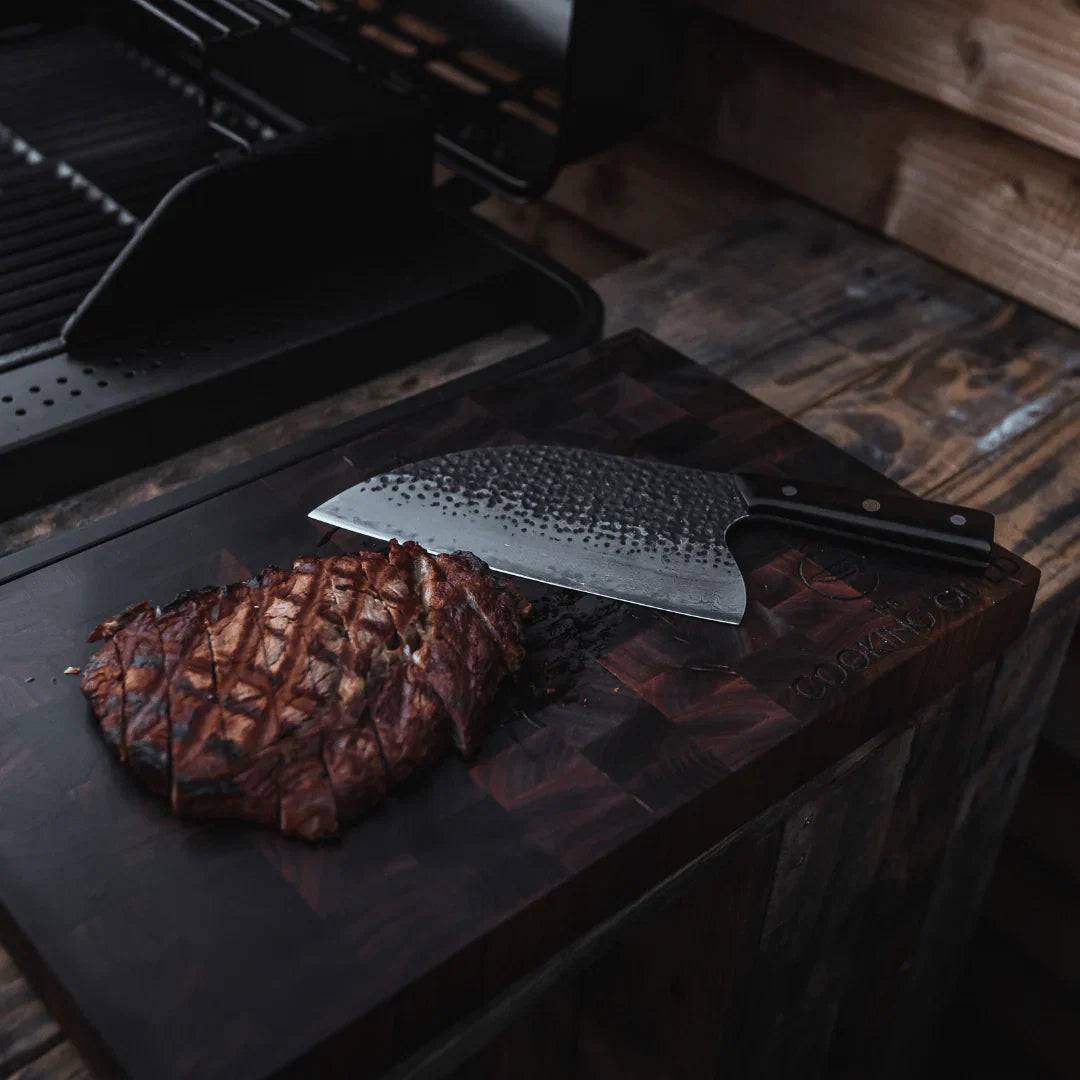Custom handmade Damascus cleaver knife with 10-inch blade, black epoxy resin handle, and leather sheath by Knives Gear Garage.