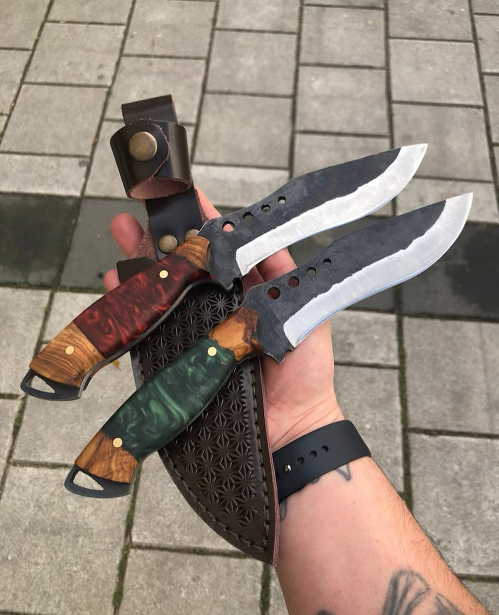 Set of five kitchen knives from Knives Gear Garage, showcasing different blade types and handles on a wooden surface.